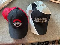 Front view of both caps showing logos and color schemes