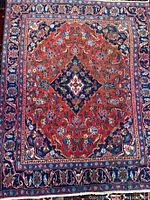 Full view of Kashan rug showing overall pattern and colors