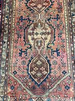 Full view of rug showing central medallion and wear