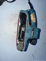 Top view of Makita 9404 belt sander showing belt path and wear