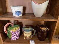 Group shot of all five ceramic pieces on shelf