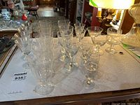 group of assorted etched stemware on table