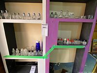 Overall shelving view showing quantity and variety of shakers