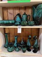 overview showing all glazed pieces on two shelves
