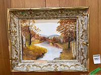 Frontal view of framed oil painting