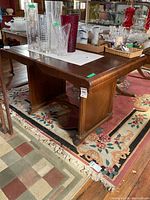 Full view of wooden table on rug