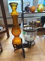Amber candlestick vase, clear hurricane vase, wood stand group shot