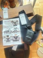 Posture brace with instruction sheet and lot tags visible