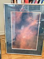 Front view of framed print showing artwork, matting and metal frame