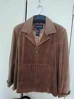 Front view of Guillaume brown suede jacket on hanger