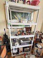 Front view of five-tier plastic shelving unit showing overall structure and size