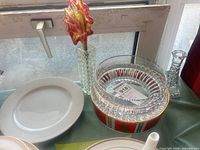 Group view showing bowls, candlestick with leaf insert, dinner plate