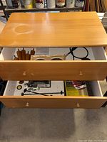 Dresser overall with drawers open showing contents
