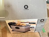 Retail box front showing Hometrends 3.5 L deep fryer image and branding