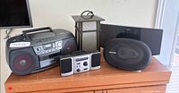Group shot of all five audio devices on dresser