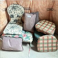 Mixed cushions stacked showing patterns and shapes