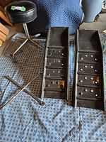 Overall view showing stool, lug wrench and pair of ramps