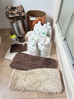 group shot of all bathroom items including rugs, bins, toiletry bottles, accessories