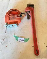 Jigsaw and pipe wrench overall view