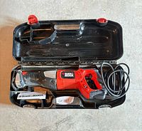 Saw in open case showing overall condition and accessories