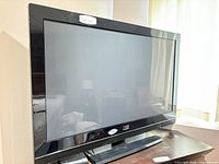 Front view of Fluid 42" plasma TV on stand