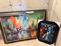 Both framed artworks side by side