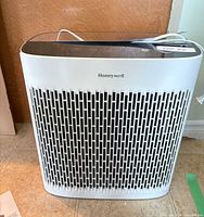 Front view of Honeywell air purifier showing grille and logo