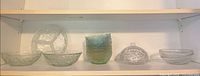 All nine glass pieces on shelf