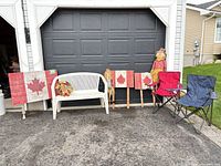 Group view of bench, chairs, flags, scarecrows and planter
