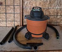 Full view of Ridgid wet/dry vac with hose, wands and nozzle