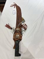 Full view of machete in sheath