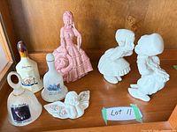 All items grouped on shelf showing bells, figurines, relative sizes