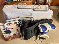 All items grouped together: lifting cushion box, safety rails, massage mat, Back2Life unit