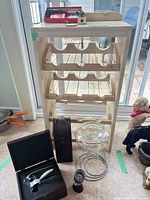 Full view of wine rack with accessories arranged below
