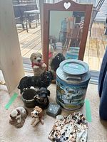 Group shot showing mirror, milk can, dog figurines, memorial stone and throw