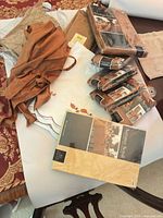 Overall lot showing packaged tablecloth, four seat-cover packs, loose fabric pieces