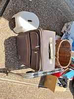 Suitcase, wicker basket, folding rack overview