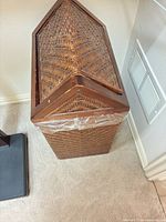 Top view showing hinged triangular lid and wicker pattern