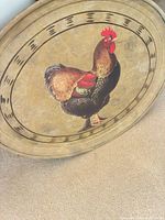 Front of tray showing rooster design and border