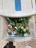 Top view of Sterilite tote showing ornaments, greenery and holly sprigs