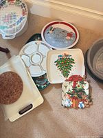 Group shot showing most platters, trays, cork trivets and handled tray