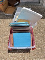 Plastic tote with loose blue, brown and manila letter folders