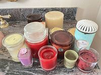 Group view of all 11 candles on countertop