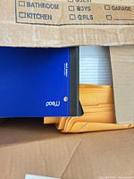Blue Mead spiral notebook, manila envelopes, loose lined paper in box