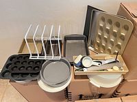 Group shot of all bakeware, bowls, rack and utensil tray