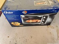 Front of Oster box showing product image and specifications