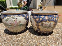 Pair of porcelain fishbowl planters, exterior scenes visible