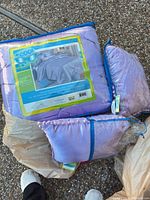 Sealed comforter package with label and two decorative pillows