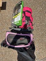 Stroller folded with carrier on top and boxed playpen