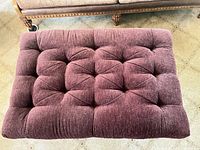Top view of plum chenille tufted ottoman cushion